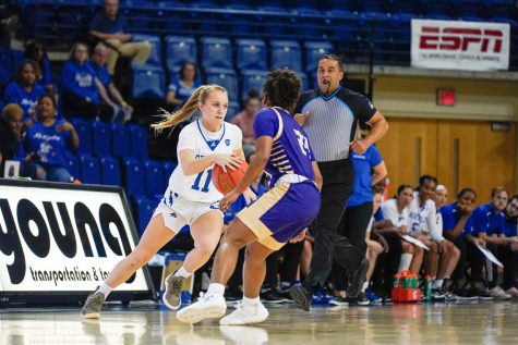 Freshman Millie Brown brings the ball up the court as the second quarter approaches. 
