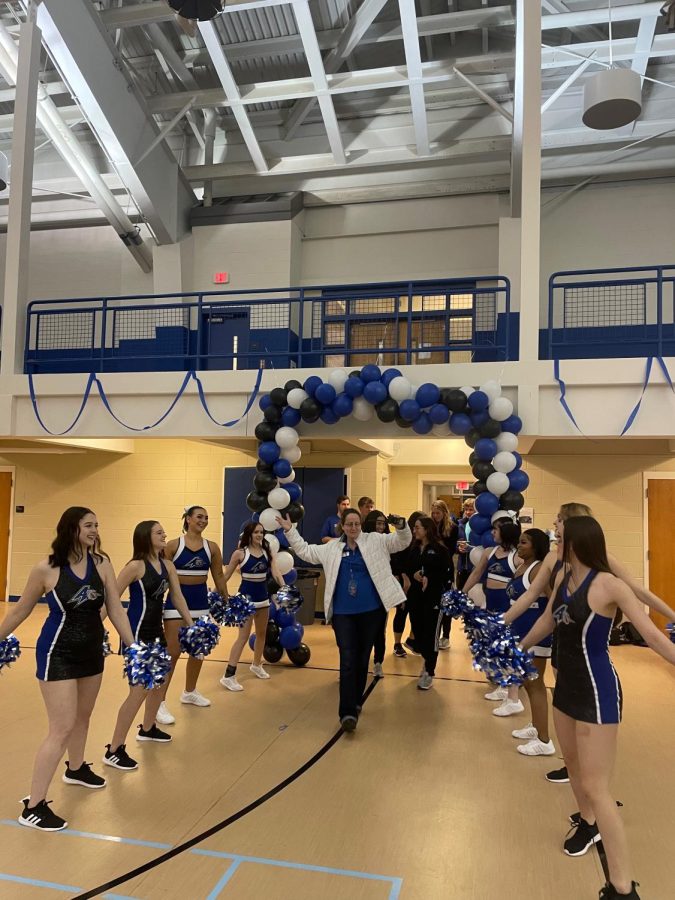 Associate Vice Chancellor of student affairs Nancy Yeager dances with the dance and cheer team. 