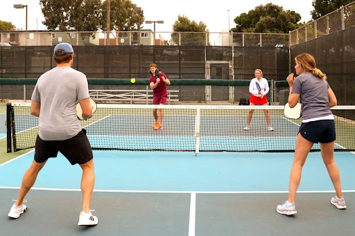 Players compete on the pickleball court.