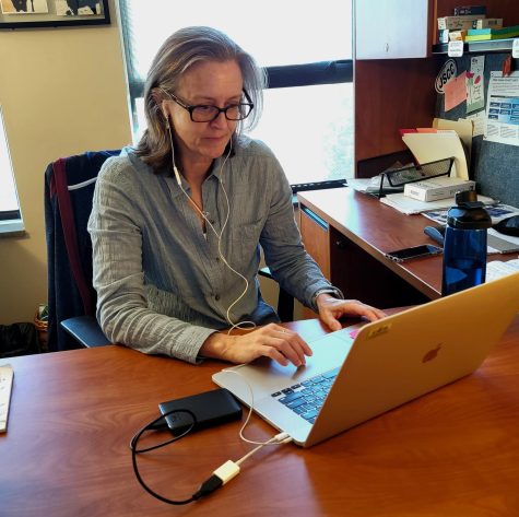 Dr. OBrien in her office, editing a documentary piece that she is working on with Dr. Slatton.
