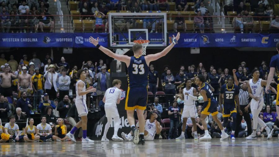 Senior center Jake Stephens gestures to the officials after a no-call for the Mocs.