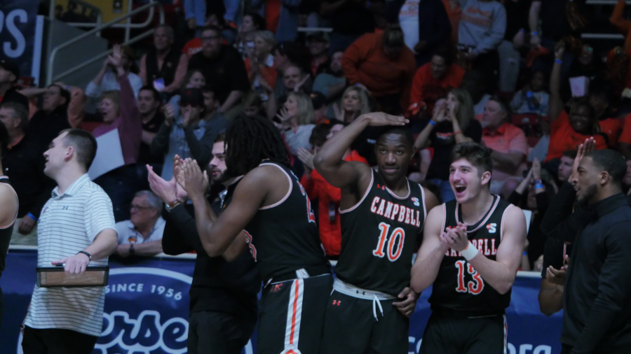 Campbell’s bench celebrates a dunk by Senior forward Jay Pal. The Fighting Camels held a lead for 32:26 of the contest. 