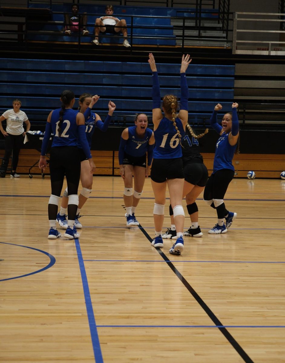 UNCA Volleyball team cheers each other on.