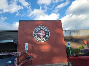 An exterior shot of Juicy Lucy’s, located on Hendersonville Road.