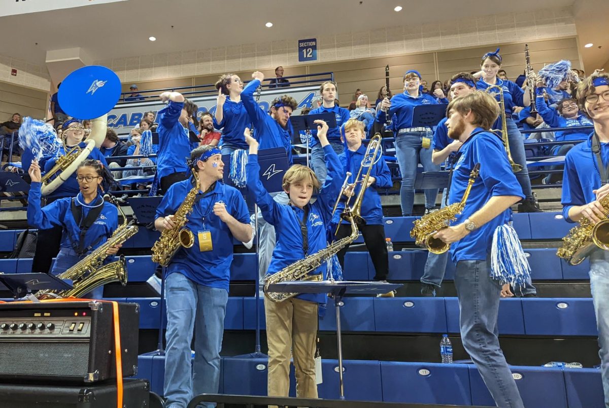 UNCA pep band celebrating during a basketball game.
