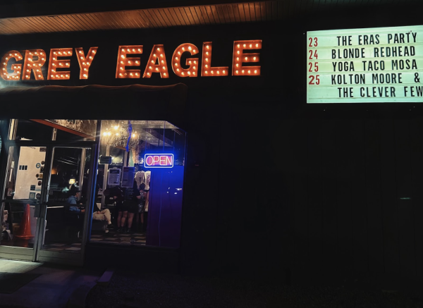 Fans buy merchandise inside The Grey Eagle for “ The Eras Party.”