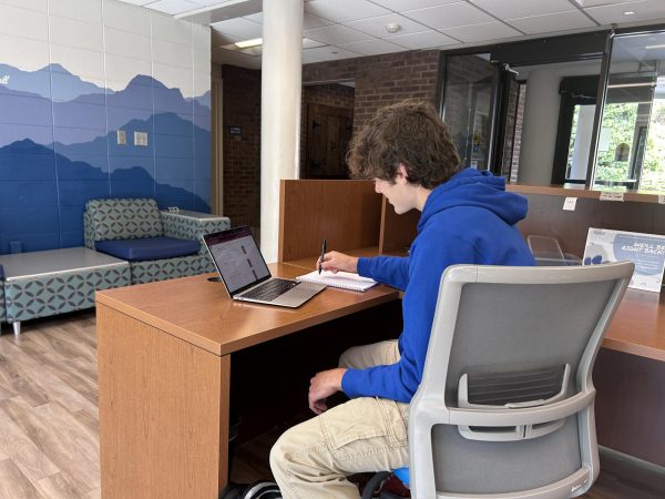  Logan Deaver researches candidates for the upcoming presidential election.