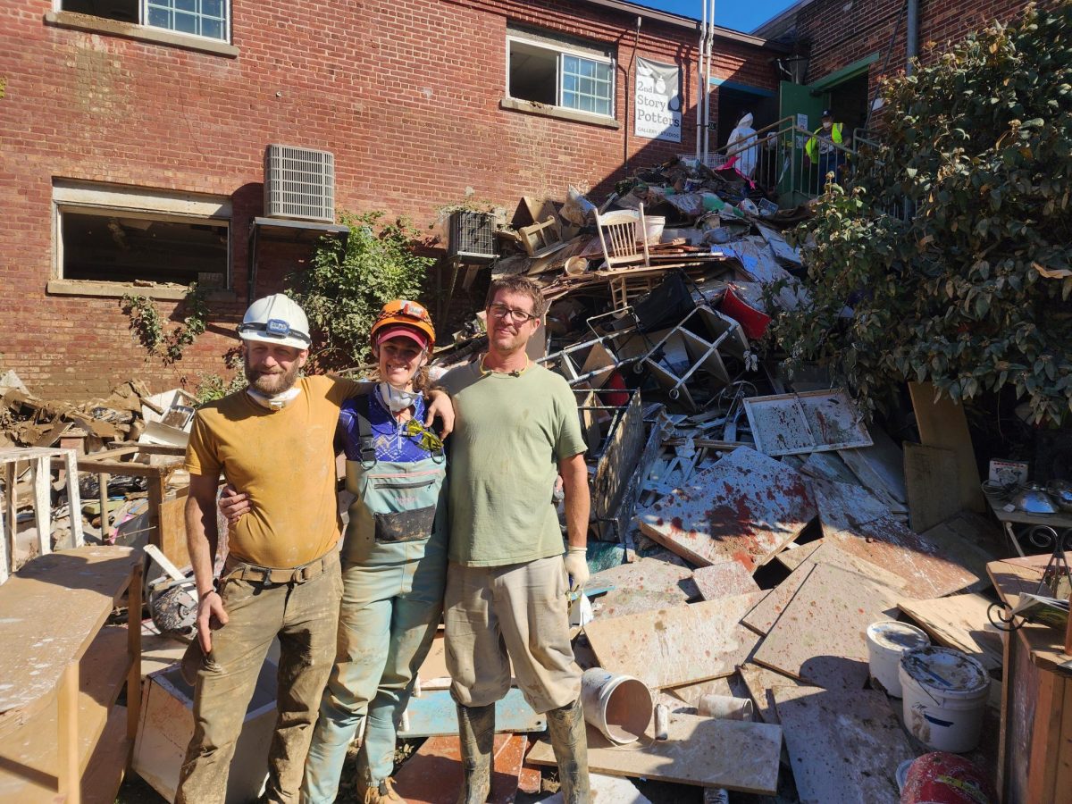 Daniel Vanbrocklin, Elizabeth Pearson-Snow and Matthew Rawlings rest after a long day of art studio cleanup.