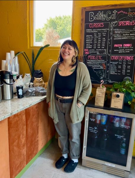 Battlecat Coffee manager Hayley Lusk poses in front of the counter.