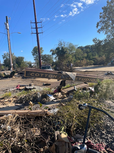 Damaged Cotton Mill Studios sign and debris in River Arts District, Asheville. 