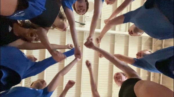 UNC Asheville swim and dive members Beatrice Cocconcelli, Tess Peny, Savana Bush, Meli Priesly, Olivia Ciancimino, Miriam Wheatley, Caroline Crouse, Danai Gkogkosi cheering for Swimming Intersquad 2024 