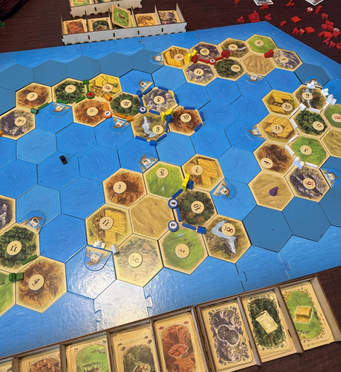 Abigail Cutler conquers and wins CATAN Seafarers with her family.