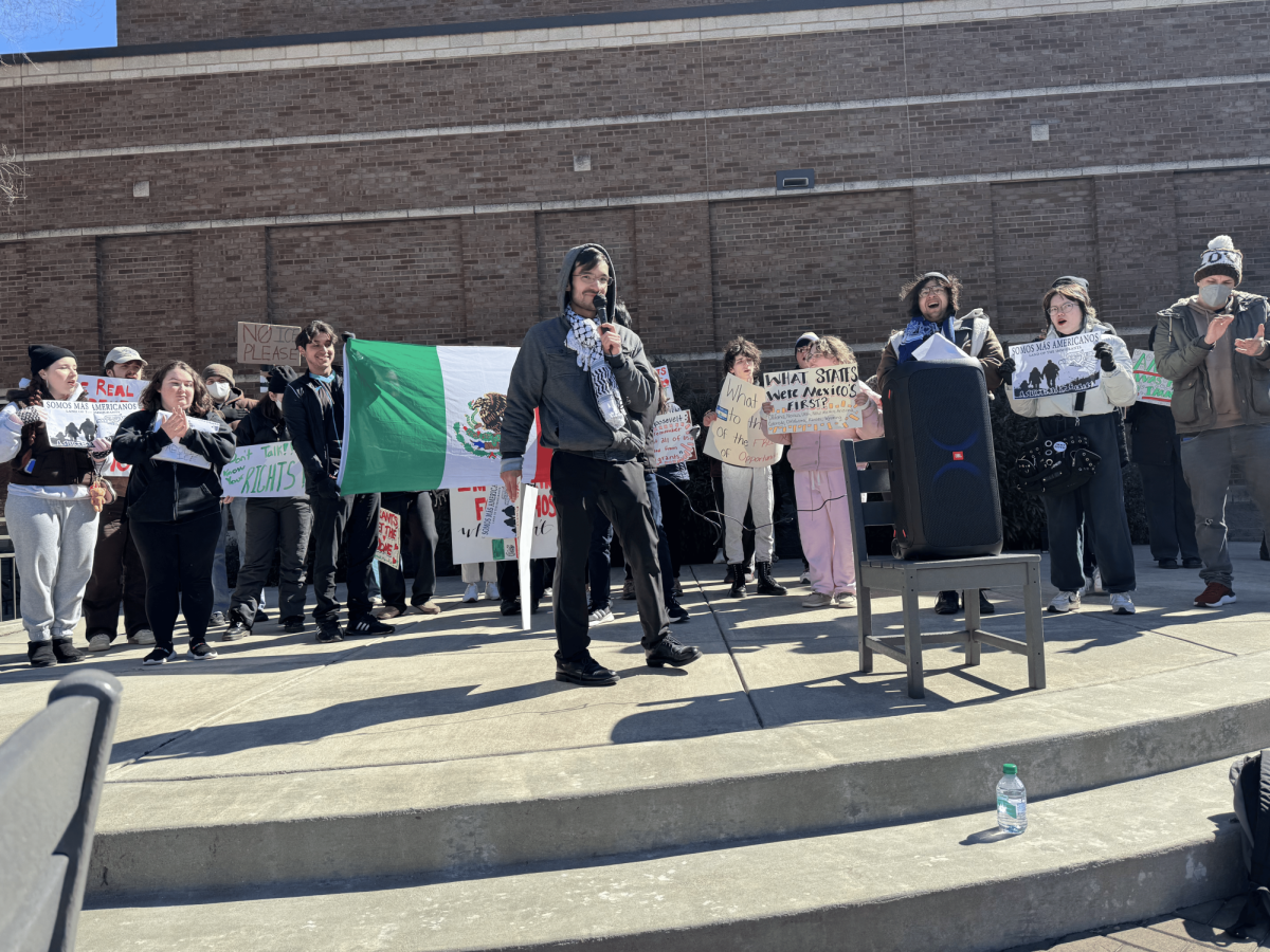 Along with fellow student protesters, Omar Ponce speaks out against campus ICE presence.