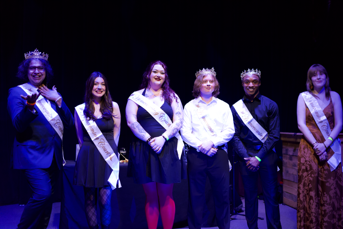 UNC Asheville's 2025 Homecoming court poses with their crowned royal family.