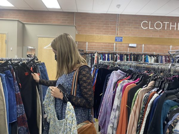 Madeline Wittschen, a fifth year senior music student at UNC Asheville, thrifts at Goodwill.