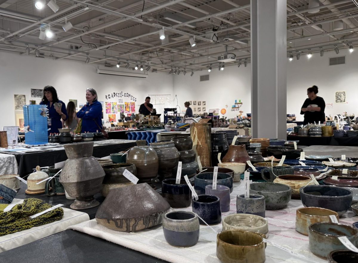 At UNCA’s biannual sale in Owen Hall, shoppers buy original ceramics, illustrations, and jewelry crafted by student artists.
