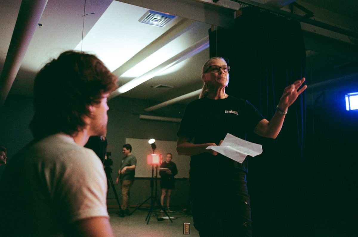 Anne Slatton, Director and Dan Wood, a member of the cast for “Code Chickadee: The Sensei Bob Story.” on set shooting on campus.