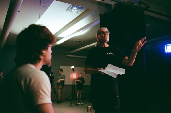 Anne Slatton, Director and Dan Wood, a member of the cast for “Code Chickadee: The Sensei Bob Story.” on set shooting on campus.