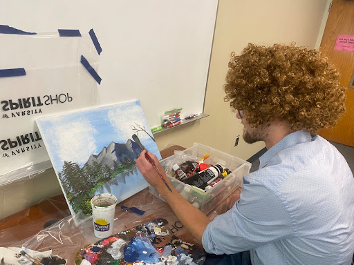 Joe Wood, student wellness leader at UNCA, leading a Bob Ross Paintalong on Wednesday, Sept. 10.