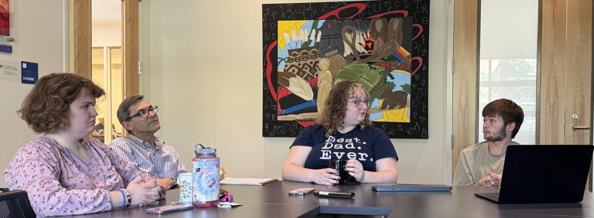 Maddy Hayler, Hillel Faculty Advisor Grant Hardy, President Lily Kie and Co-President Callum Bradford in deep discussion in the to ki ya sdi room in the Highsmith Student Union. 