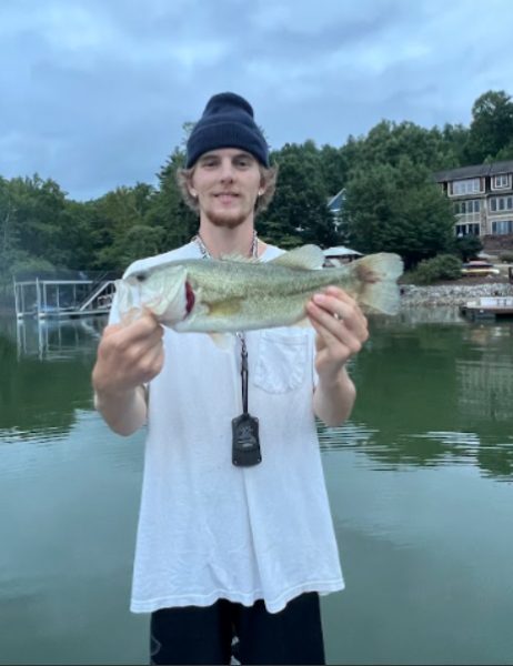 Manning Stewart shows off the largemouth bass he caught in Lake James.
