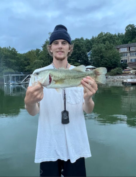 Manning Stewart shows off the largemouth bass he caught in Lake James.