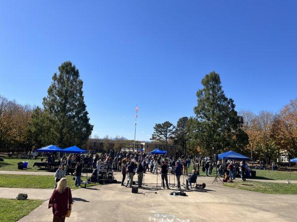 Students attend Turning of the Maples in the quad.