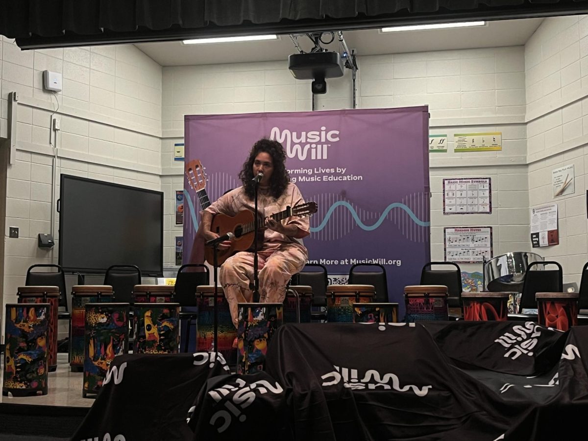 DeSouza performs at Lucy S. Herring Elementary School
