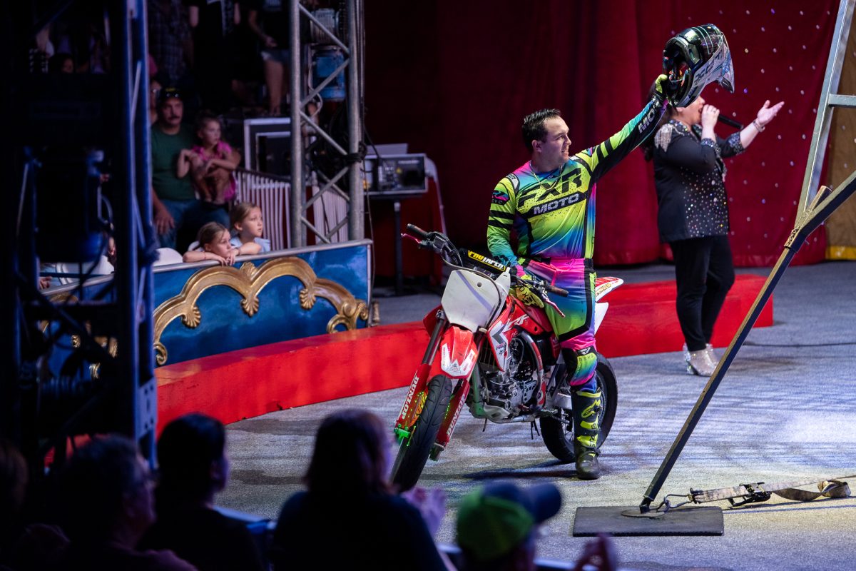 Brandon Fernandez enters the stage on his motorcycle stunt bike, ready to start the performance.