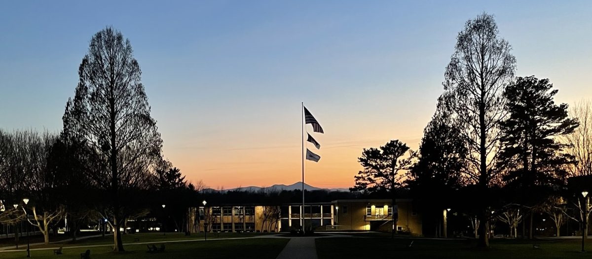 UNCA flagpole in quad during sunset. 