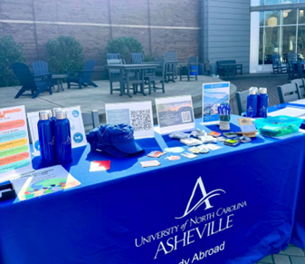 Photo of the Study Abroad stand at Reed Plaza. From UNCA Study Abroad Instagram account.