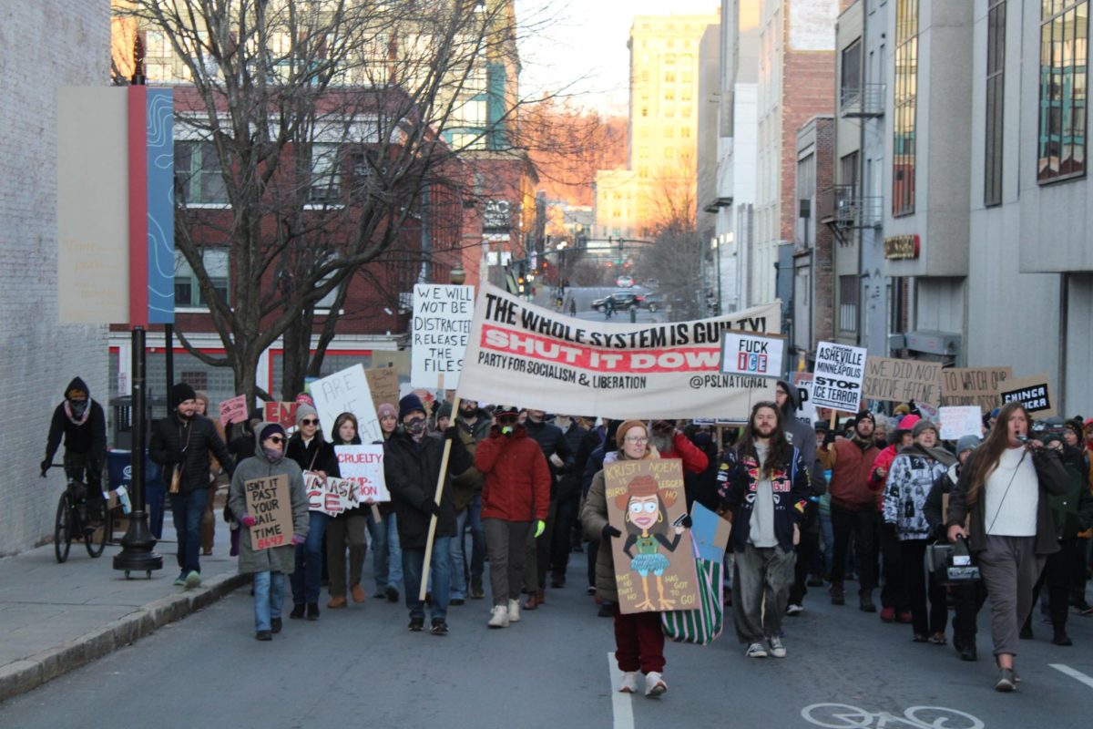 Protestors marching on College St. in downtown Asheville.