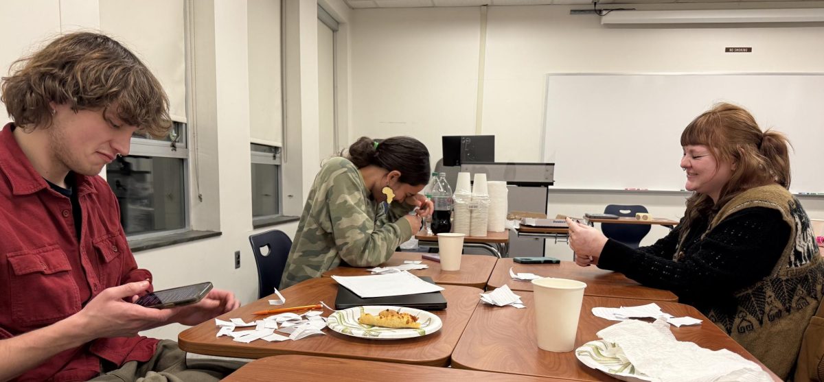 Treasurer Sam Crandall and Lit Club members Jayden Hodges and Dexter Corcoran playing Fictionary in Karpen Hall.